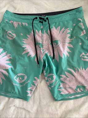 Volcom Men’s Teal Swim Board Shorts with Pink Sunburst Print